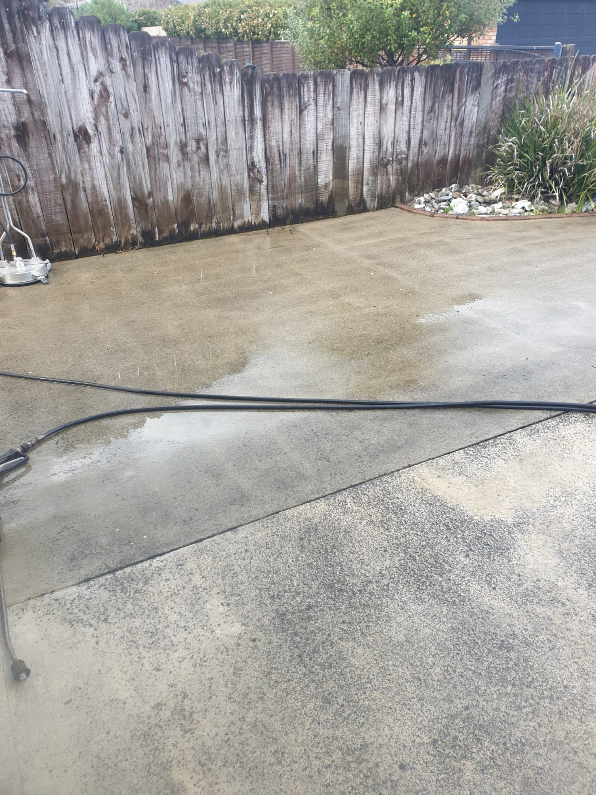 Commercial driveway being pressure washed