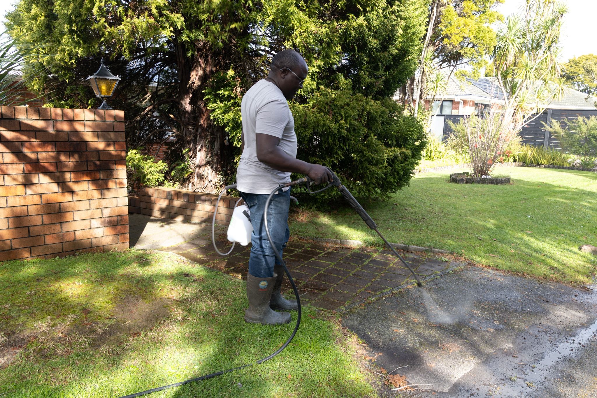 ZambeZy team waterblasting a brick pathway